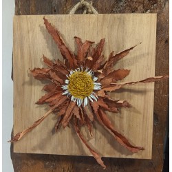 EGUZKILORE SOBRE MADERA